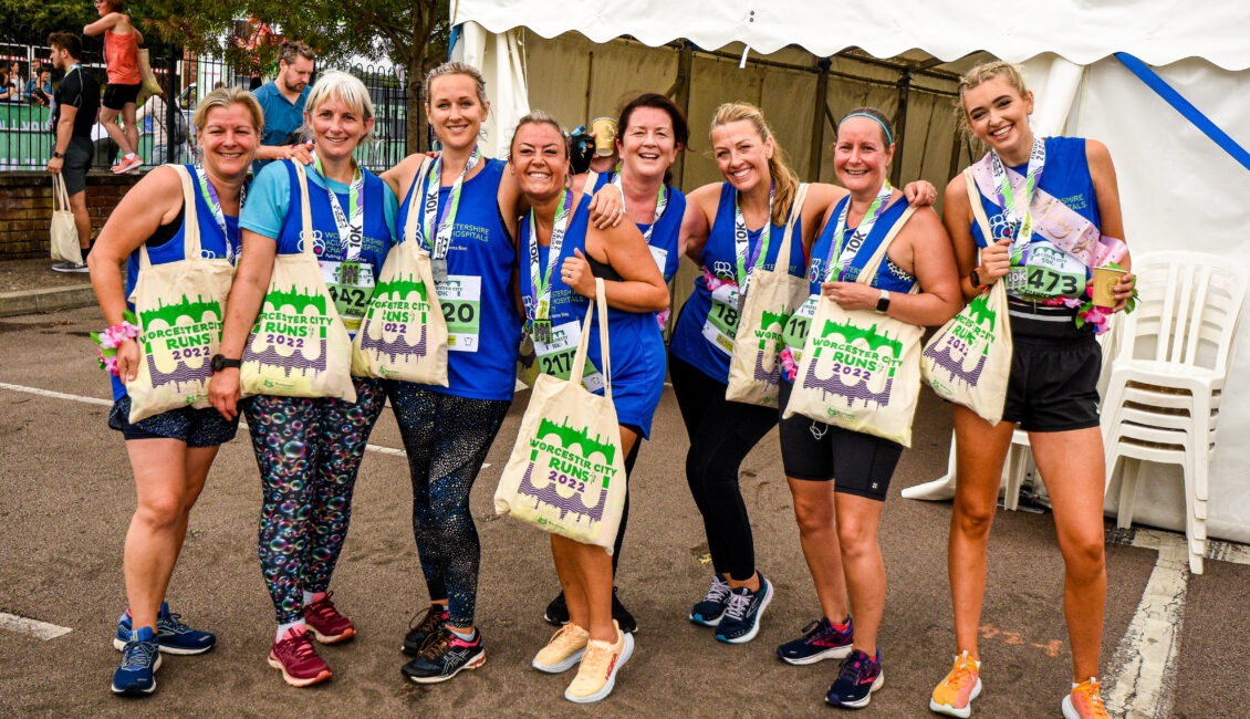 8 runners for Worcestershire Acute Hospitals NHS Trust with medals and bags from Worcester City Runs 2022.