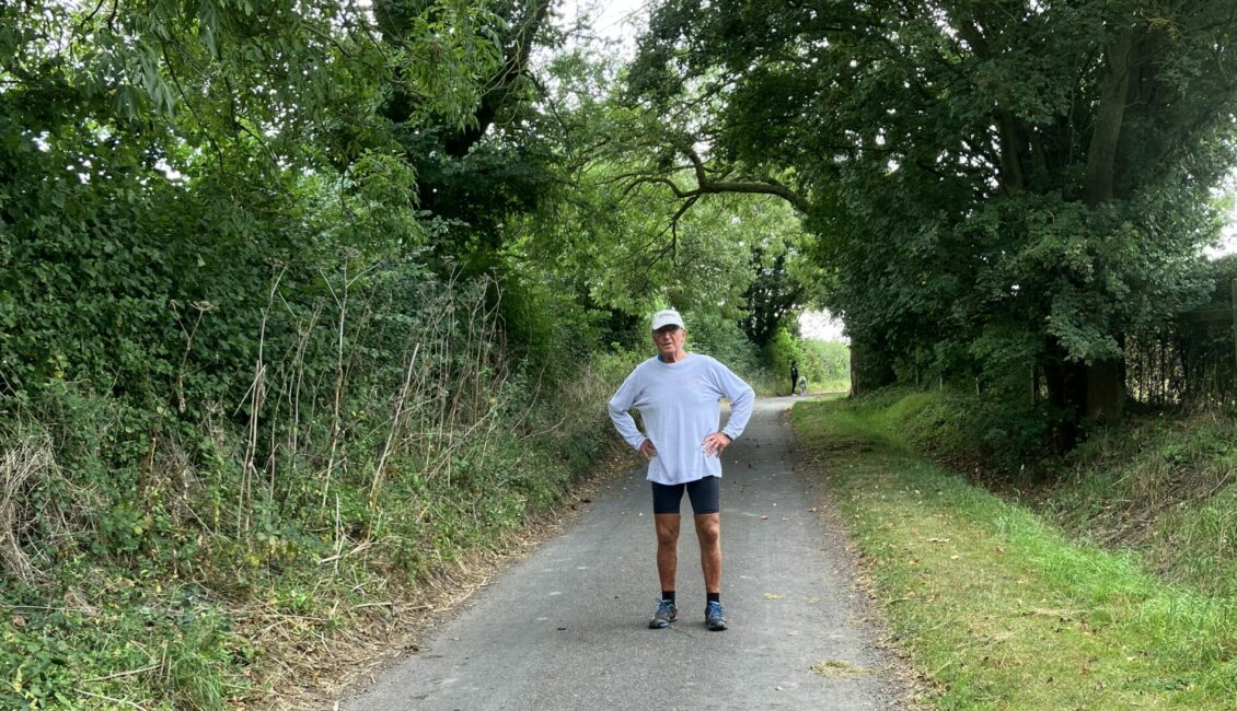 Runner Les Bailey standing on a countryside road.