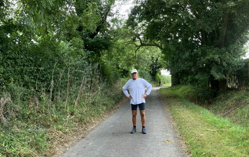 Runner Les Bailey standing on a countryside road.